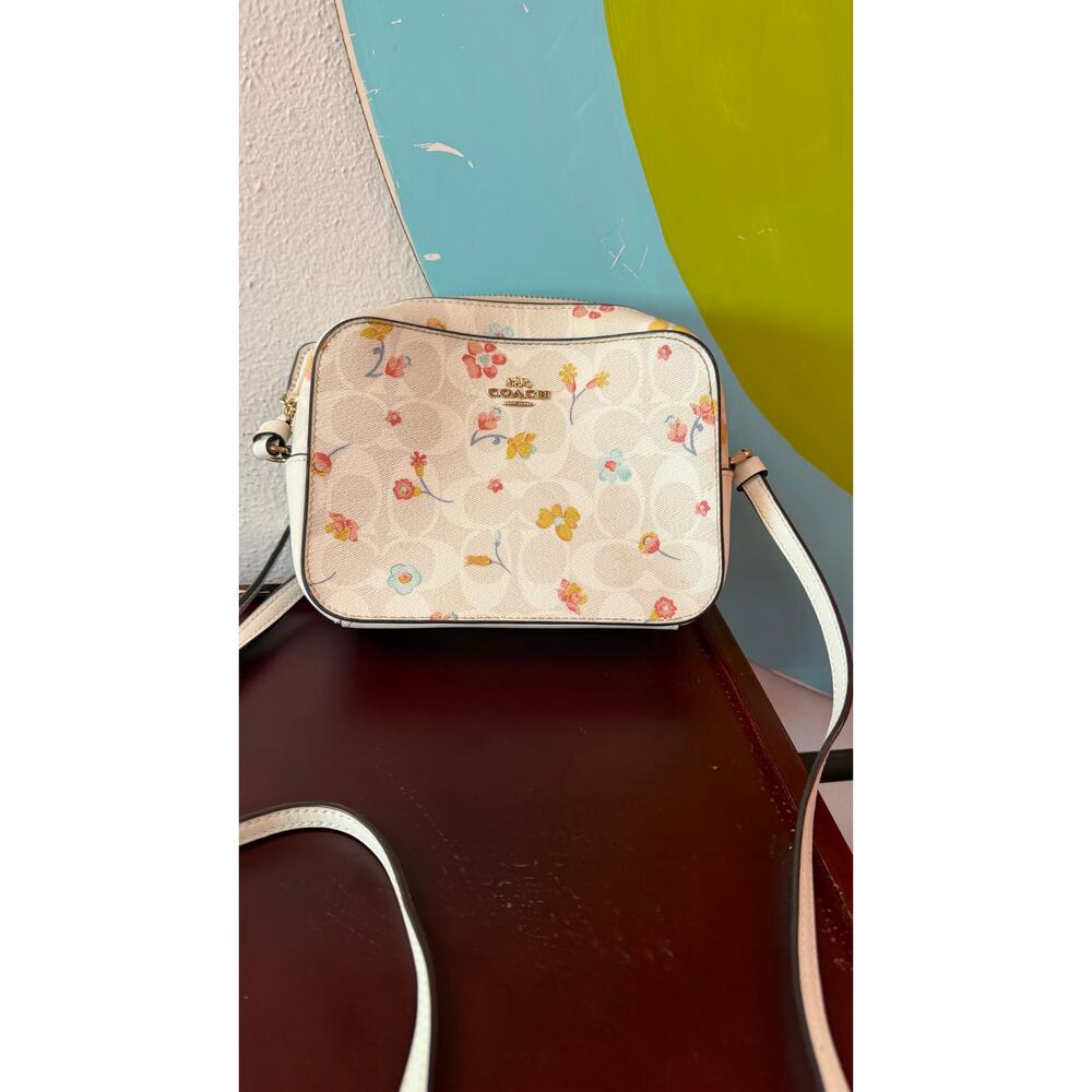 Coach White crossbody bag with floral pattern